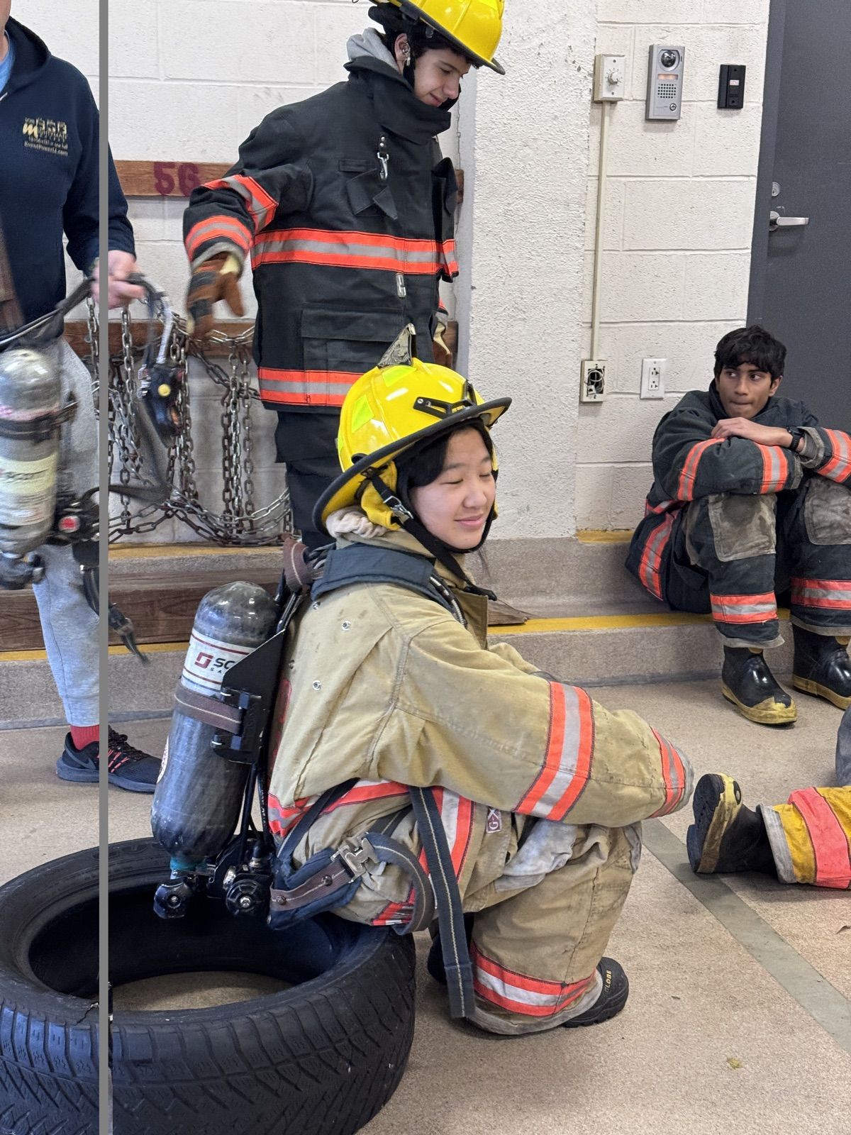 Rachel in turnout gear during Fire Explorer training