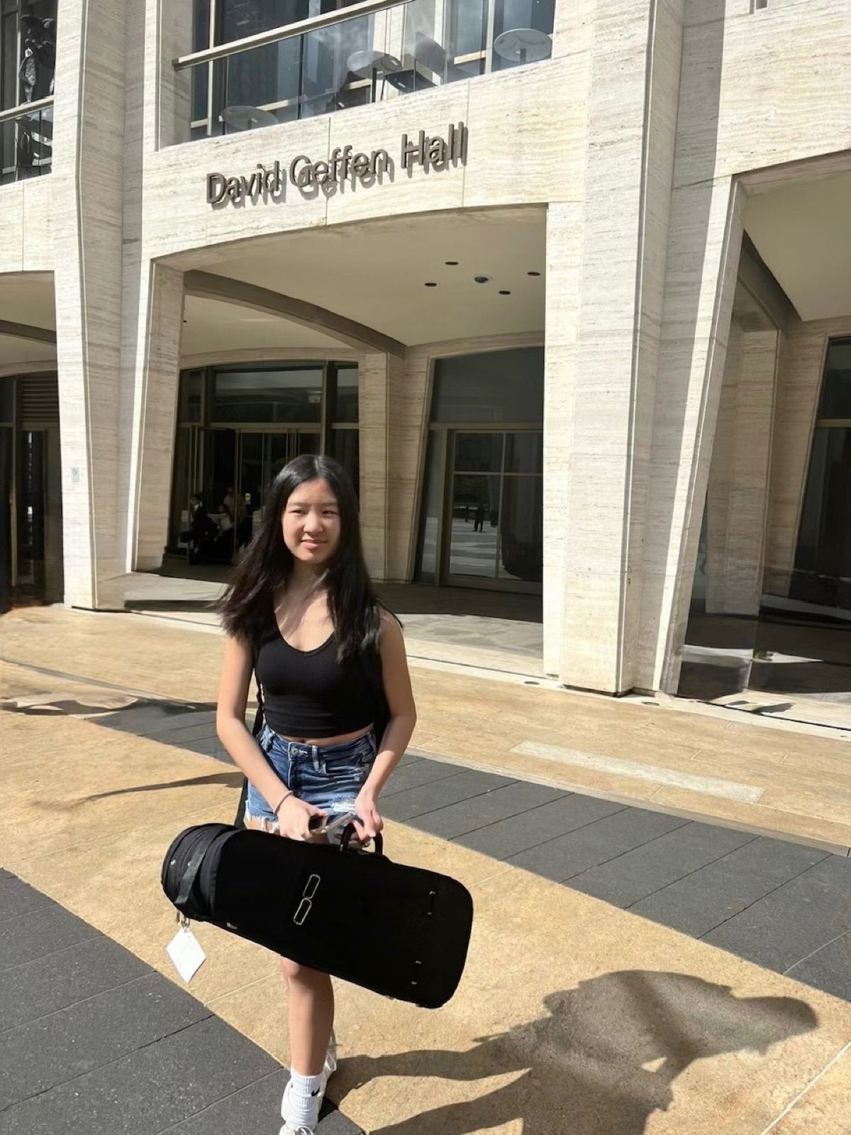 Rachel with her violin case